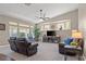 Bright living room with vaulted ceilings, neutral tones, and plenty of natural light at 7411 Brittlethorne Ave, Las Vegas, NV 89131