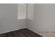 Bedroom featuring wood-look flooring and two windows that allow natural light at 75 N Valle Verde Dr # 411, Henderson, NV 89074