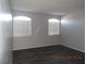 Bedroom with wood flooring and ample natural light from two large windows at 75 N Valle Verde Dr # 411, Henderson, NV 89074
