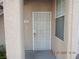 Close-up of the front entrance with white security door and address number 411 at 75 N Valle Verde Dr # 411, Henderson, NV 89074