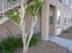 Charming front entrance with well-maintained landscaping and a secure white security door at 75 N Valle Verde Dr # 411, Henderson, NV 89074