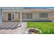 Backyard features large patio and access to home with adjacent planter at 7824 Faith Ct, Las Vegas, NV 89131