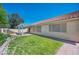 Well maintained backyard with patio, grassy area and easy access to home at 7824 Faith Ct, Las Vegas, NV 89131