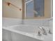 A bright bathtub is illuminated by a nearby window providing an open feeling at 7824 Faith Ct, Las Vegas, NV 89131
