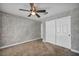 This bedroom offers a ceiling fan, closet, carpeted floors, and neutral paint at 7824 Faith Ct, Las Vegas, NV 89131
