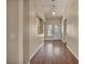 Inviting entryway features stylish lighting, decorative niche, and gleaming hardwood floors at 7824 Faith Ct, Las Vegas, NV 89131