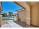 Front porch of the house showcases the secured gate entrance, with landscaped yard at 7824 Faith Ct, Las Vegas, NV 89131
