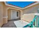 Close-up of the front porch and entrance, featuring a secure gate and tiled flooring at 7824 Faith Ct, Las Vegas, NV 89131