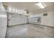 Spacious two car garage with extra storage space and an automatic door at 7824 Faith Ct, Las Vegas, NV 89131