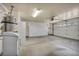 Spacious garage with room for parking and storage, including wall cabinets at 7824 Faith Ct, Las Vegas, NV 89131