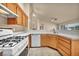 Bright kitchen featuring tile floors, wooden cabinets and white appliances at 7824 Faith Ct, Las Vegas, NV 89131