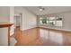 Open floor plan with hardwood floors, a fireplace, and view of the backyard at 7824 Faith Ct, Las Vegas, NV 89131
