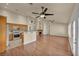 Spacious living room showcasing wood floors, high ceilings, a fireplace, and kitchen access at 7824 Faith Ct, Las Vegas, NV 89131