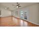 Bright living room features wood floors, ceiling fan, recessed lights and glass patio doors at 7824 Faith Ct, Las Vegas, NV 89131