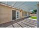 Back patio with white pergola, brick flooring, and slider access to home at 7824 Faith Ct, Las Vegas, NV 89131