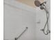 Updated shower features dual shower heads and accessibility grab bar at 7824 Faith Ct, Las Vegas, NV 89131