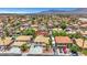 Overhead view of a neighborhood with many homes, mature trees, and an RV parked in the driveway of one at 8224 Fawn Meadow Ave, Las Vegas, NV 89149