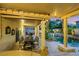 Outdoor dining area, pool, and covered patio ideal for outdoor entertaining at 8224 Fawn Meadow Ave, Las Vegas, NV 89149