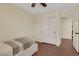A small bedroom features a bed, closet, and wood floors at 8224 Fawn Meadow Ave, Las Vegas, NV 89149
