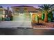Charming two-story home featuring a three-car garage, landscaped yard, and inviting front entrance at 8224 Fawn Meadow Ave, Las Vegas, NV 89149