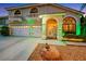 Charming two-story home featuring a three-car garage, landscaped yard, and inviting front entrance at 8224 Fawn Meadow Ave, Las Vegas, NV 89149