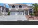 Charming two-story home featuring a three-car garage, balconies, and well-maintained landscaping at 8224 Fawn Meadow Ave, Las Vegas, NV 89149