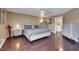 Main bedroom shows hardwood floors, modern furniture, and a window at 8224 Fawn Meadow Ave, Las Vegas, NV 89149