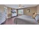 Spacious main bedroom has hardwood floors, ceiling fan, and modern furniture at 8224 Fawn Meadow Ave, Las Vegas, NV 89149