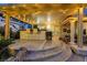 Inviting covered outdoor kitchen area with bar seating and a grill, perfect for backyard gatherings at 8224 Fawn Meadow Ave, Las Vegas, NV 89149