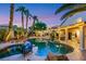 Outdoor pool and desert landscaped backyard with spa, covered patio and BBQ at 8224 Fawn Meadow Ave, Las Vegas, NV 89149