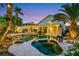 Inviting backyard oasis featuring a private pool, spa, and lush landscaping perfect for outdoor entertaining at 8224 Fawn Meadow Ave, Las Vegas, NV 89149