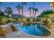 Backyard featuring a sparkling pool and desert landscaping perfect for outdoor relaxation at 8224 Fawn Meadow Ave, Las Vegas, NV 89149