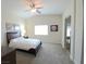 This spacious bedroom has a ceiling fan and neutral paint, perfect for any decor at 8305 Minots Ledge Ave, Las Vegas, NV 89147
