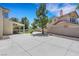 A view of the backyard, which features a large patio and small lawn at 8481 Lambert Dr, Las Vegas, NV 89147