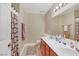 Bathroom featuring tile flooring, a dual sink vanity, and a shower/tub at 8481 Lambert Dr, Las Vegas, NV 89147