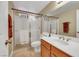 Full bathroom with glass shower, tile flooring, and dual sink vanity at 8481 Lambert Dr, Las Vegas, NV 89147