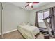 Neutral bedroom with a ceiling fan, twin bed, and treadmill at 8481 Lambert Dr, Las Vegas, NV 89147