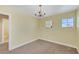 Bedroom with natural light, carpet flooring, and a chandelier at 8481 Lambert Dr, Las Vegas, NV 89147