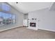 Bright bedroom with a vaulted ceiling, carpet flooring, and a fireplace at 8481 Lambert Dr, Las Vegas, NV 89147