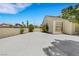 A long driveway leads to a gated area on this desert-landscaped property at 8481 Lambert Dr, Las Vegas, NV 89147