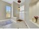 A spacious foyer with tile flooring, high ceilings, and decorative lighting at 8481 Lambert Dr, Las Vegas, NV 89147