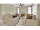 Cozy living room featuring a ceiling fan, tile flooring, and a fireplace at 8481 Lambert Dr, Las Vegas, NV 89147