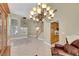 View of a living room with tile floors, a staircase, and large windows at 8481 Lambert Dr, Las Vegas, NV 89147
