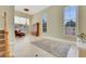 A large, airy living room with tile floors, high ceilings, and big windows at 8481 Lambert Dr, Las Vegas, NV 89147