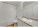 Clean bathroom featuring a combined bathtub and shower, a modern vanity with sink, and tile flooring at 8600 W Charleston Blvd # 1128, Las Vegas, NV 89117