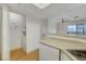 The kitchen features a breakfast bar, laundry closet, and updated appliances for modern convenience at 8600 W Charleston Blvd # 1128, Las Vegas, NV 89117