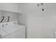 Functional laundry room equipped with a modern washer and dryer, facilitating efficient and convenient laundry tasks at 8600 W Charleston Blvd # 1128, Las Vegas, NV 89117