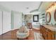 Bathroom with a walk-in shower, soaking tub, double sinks, and wood floor at 928 Aspen Valley Ave, Las Vegas, NV 89123