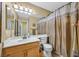 Neutral bathroom with stall shower and sink with traditional wood cabinets at 928 Aspen Valley Ave, Las Vegas, NV 89123