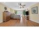 Large bedroom with a wood floor, neutral walls, ceiling fan, and a TV at 928 Aspen Valley Ave, Las Vegas, NV 89123